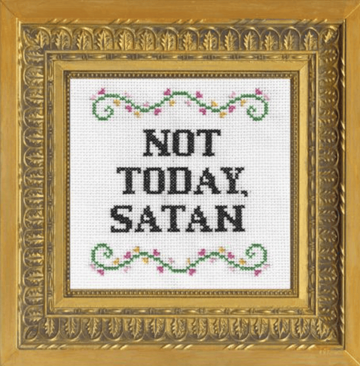 Decorative cross-stitch with 'Not Today, Satan' text in a gold frame.