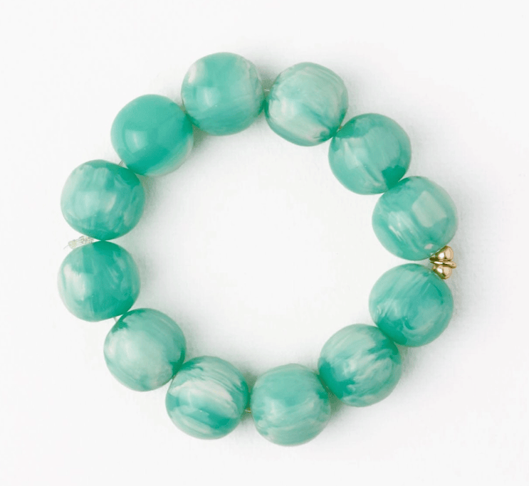 Turquoise beaded bracelet on a white background