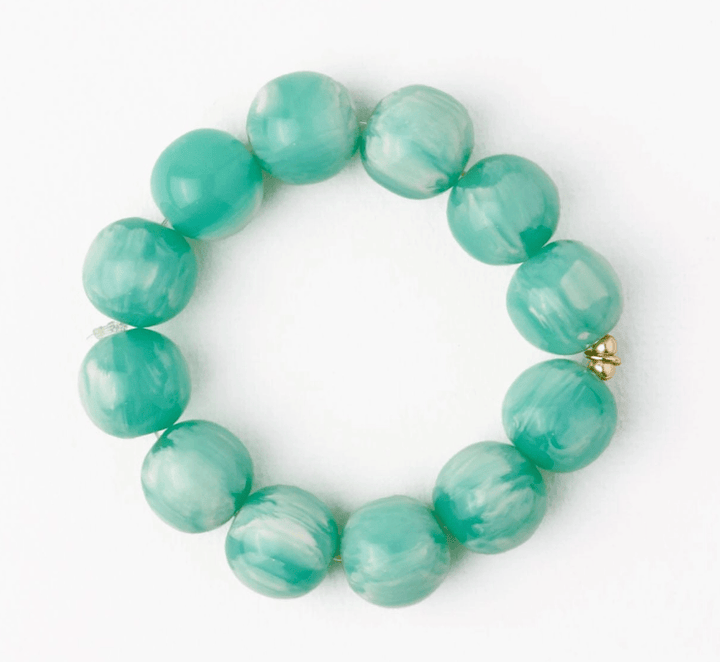 Turquoise beaded bracelet on a white background