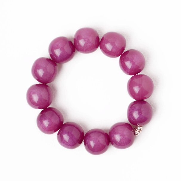 Purple beaded bracelet on a white background