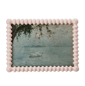 Decorative pink frame with a scenic picture of a lake and swan.