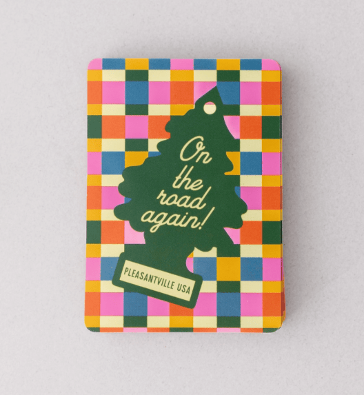 Colorful checkered playing card box with a tree-shaped sign and text on a gray background