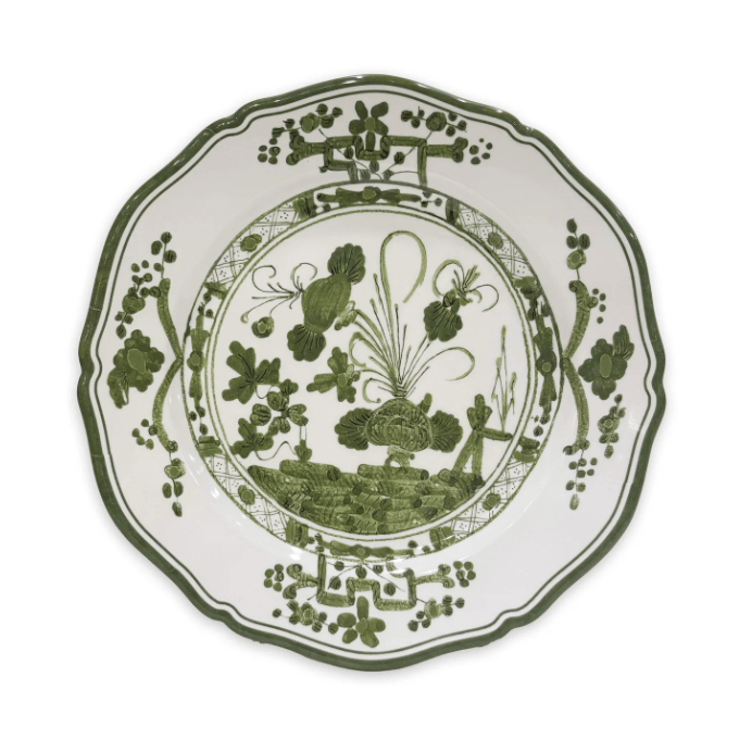Decorative melamine plate with green floral and leaf pattern on a white background