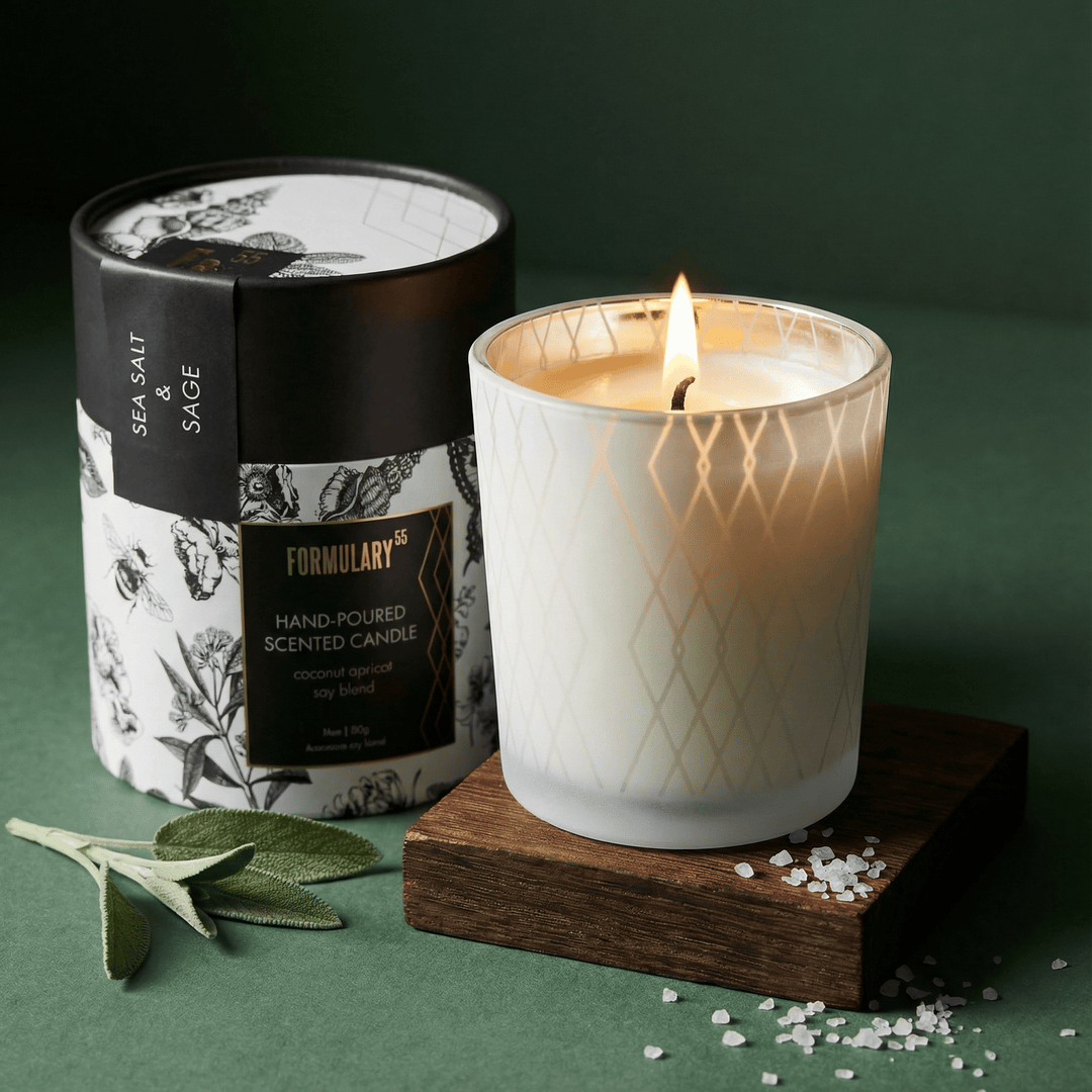 Candle with a decorative label on a green background