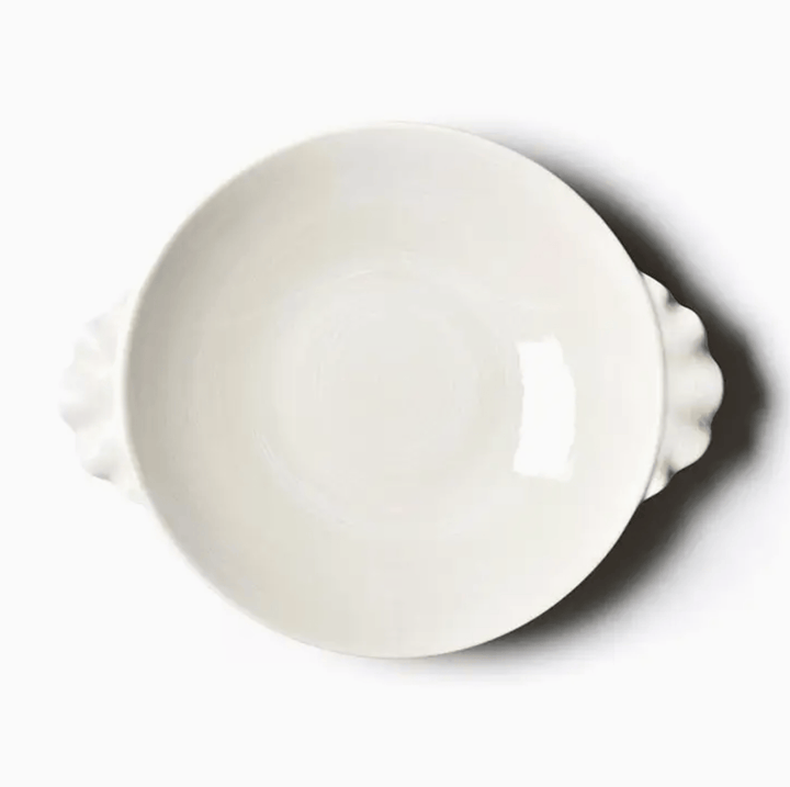 round pasta bowl with ruffle handles on a white background