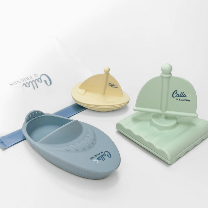 Set of colorful toy boats with 'Calla & Friends' branding on a white background
