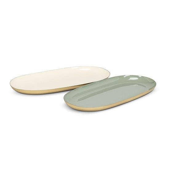 Two oval-shaped trays, one beige and one green, on a white background