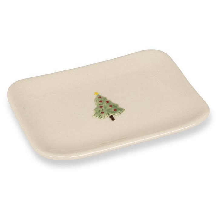 An off-white rectangular ceramic dish with rounded corners and a small painted Christmas tree motif in the center, shown on a plain white background.