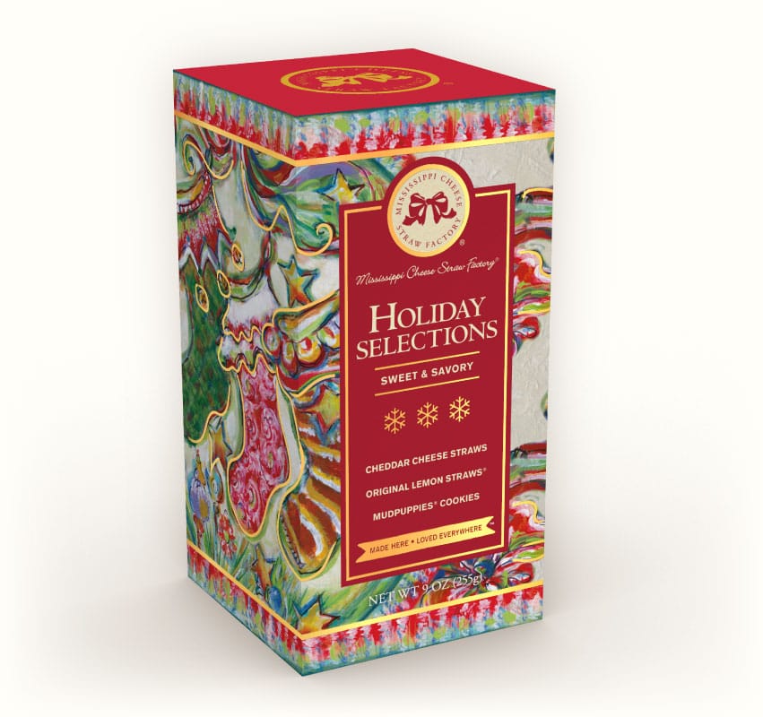 Festive holiday box of sweet and savory cheese straws on a white background