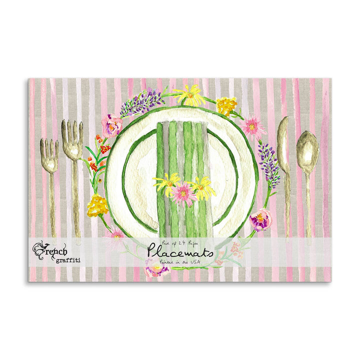 Packaging of placemats with a watermelon design and floral elements on a striped background.