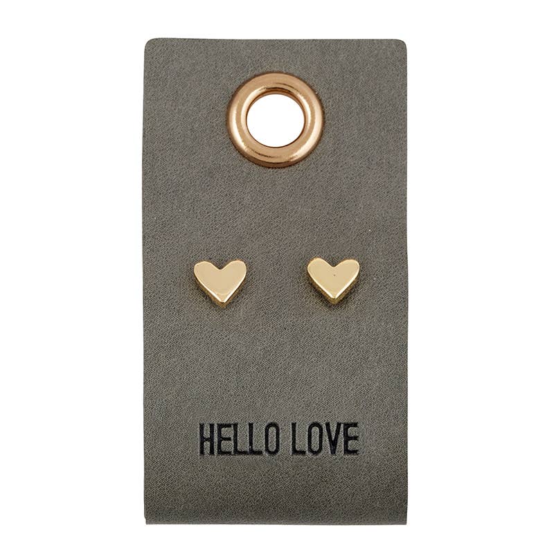 Gold heart-shaped earrings on a 'Hello Love' card
