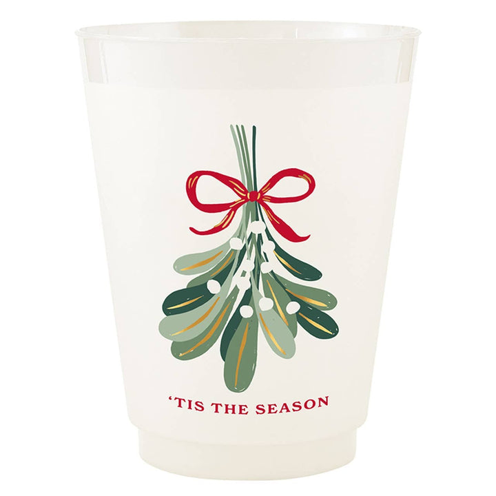 A frosted white plastic cup featuring a festive printed design of mistletoe with a red bow and the text 'TIS THE SEASON' in red at the bottom.