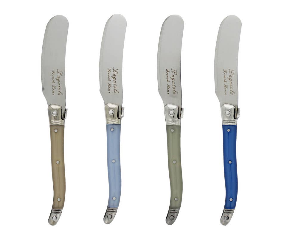 Four cheese spreaders with shades of blue or cream handles on a white background
