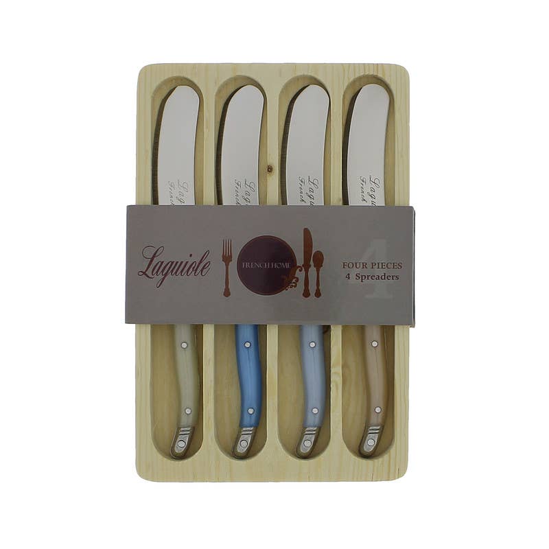 Set of four Laguiole spreaders in wooden holder with branded label.