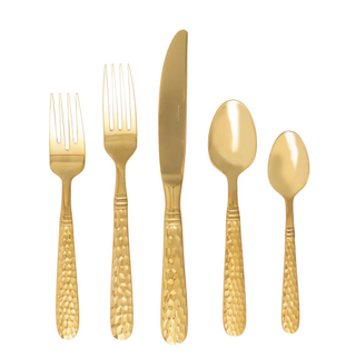 Hand-forged by Italian artisans, each piece of the weighty and well-balanced Martellato Gold 5-Piece Flatware Place Setting from Vietri features a hammered handle and is made of 18/10 stainless steel.