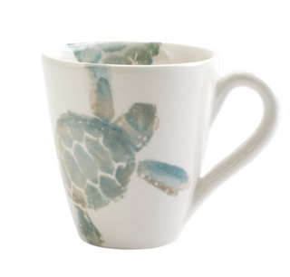 The handpainted sea turtle is rendered in hues of aqua and taupe against a clean, white canvas on the Tartaruga Mug from Vietri. Maestro artisan, Gianluca Fabbro, utilizes a unique sponging technique to carefully add detail to each piece.  Product Dimensions: 4.25"H, 14 oz
