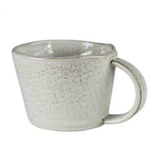 A mug to wrap your hands around. Ceramic embossed with a linen texture.