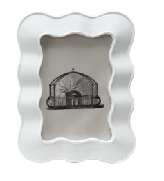 White wavy frame with a black and white photo of a building inside on a white background