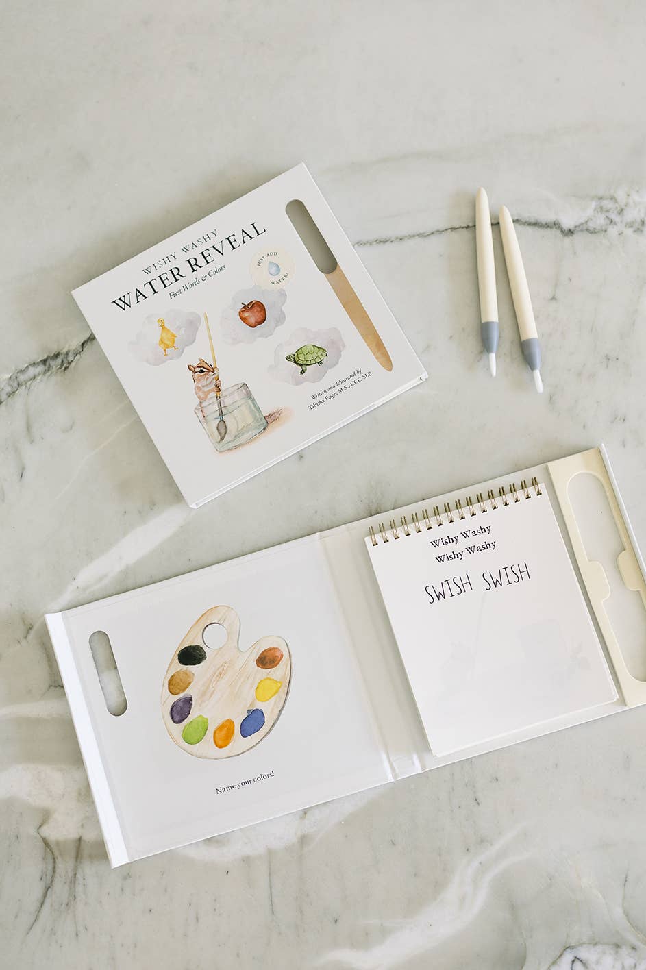 Children's book with watercolor illustrations on a marble surface