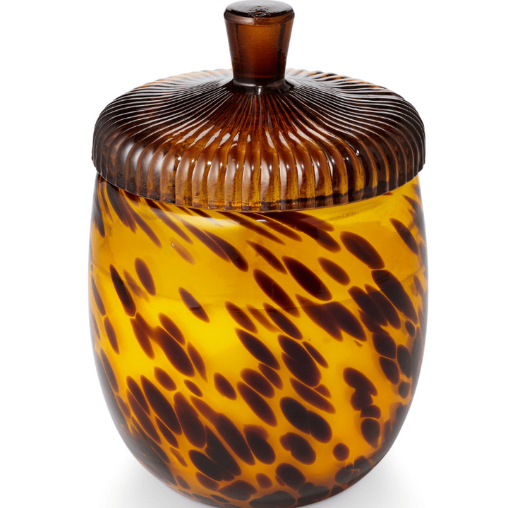 A decorative glass jar with a ribbed lid and a glossy amber-brown and yellow marbled pattern, shown on a white background.