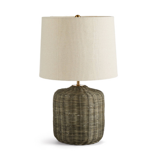 In a tight, rattan weave, the Wren Lamp adds a warm washed black look. With a bright white shade that softly filters the light, it works well in the contemporary space.