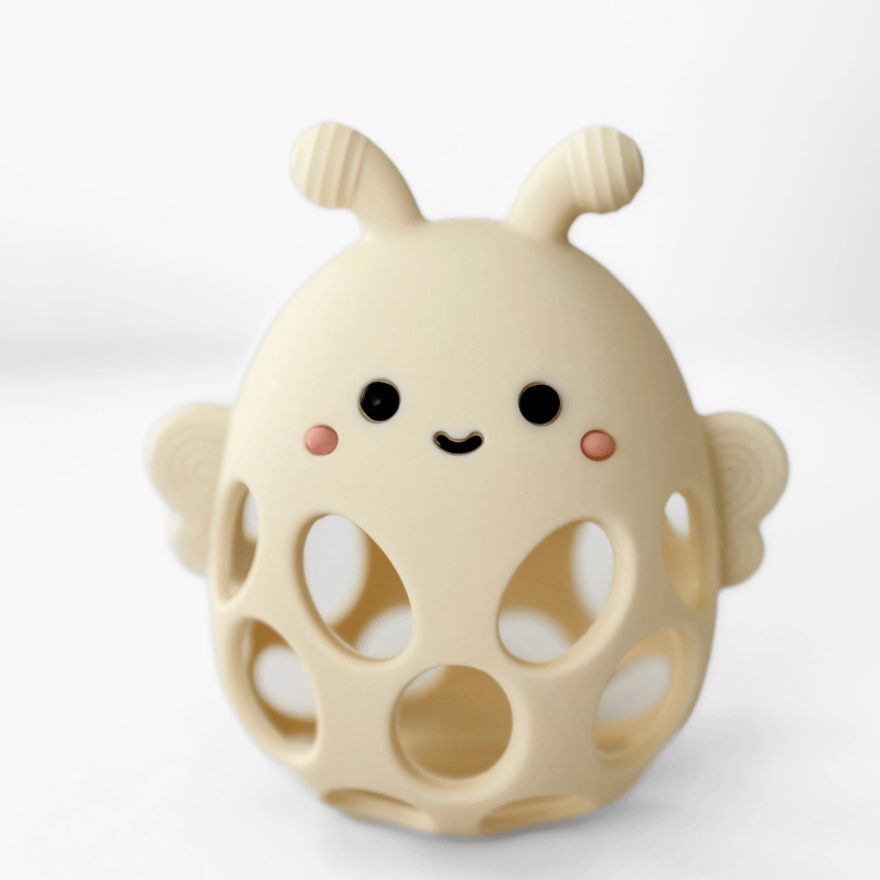 Cute beige toy with a smiling face on a white background
