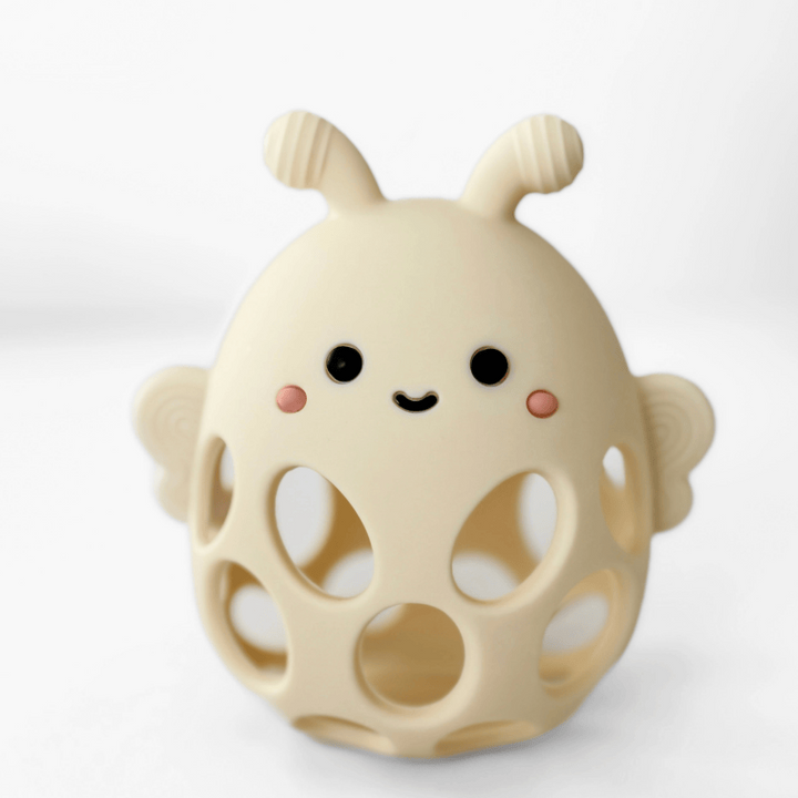 Cute beige toy with a smiling face on a white background