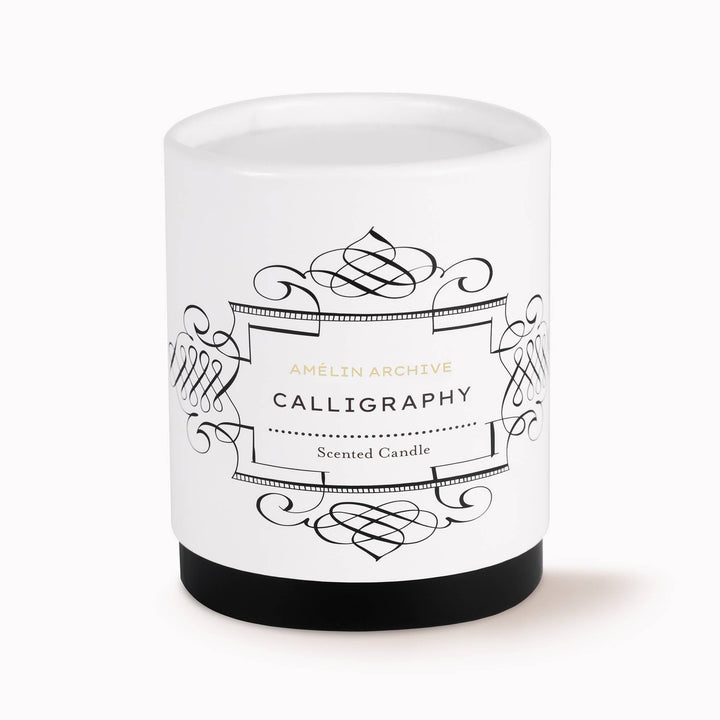 Scented candle with decorative label on a white background