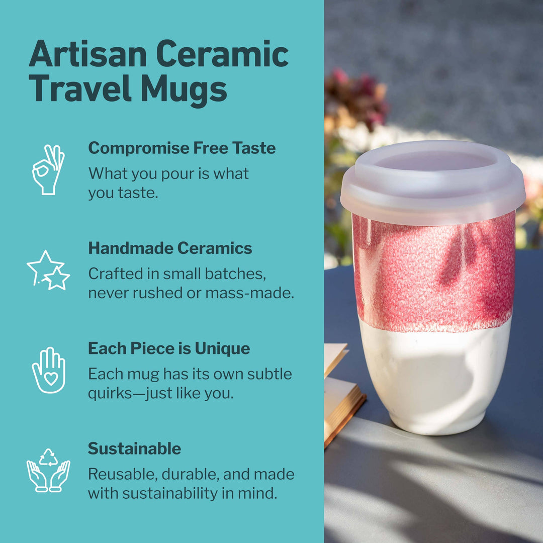 Artisan ceramic travel mug with a pink interior on a blue background