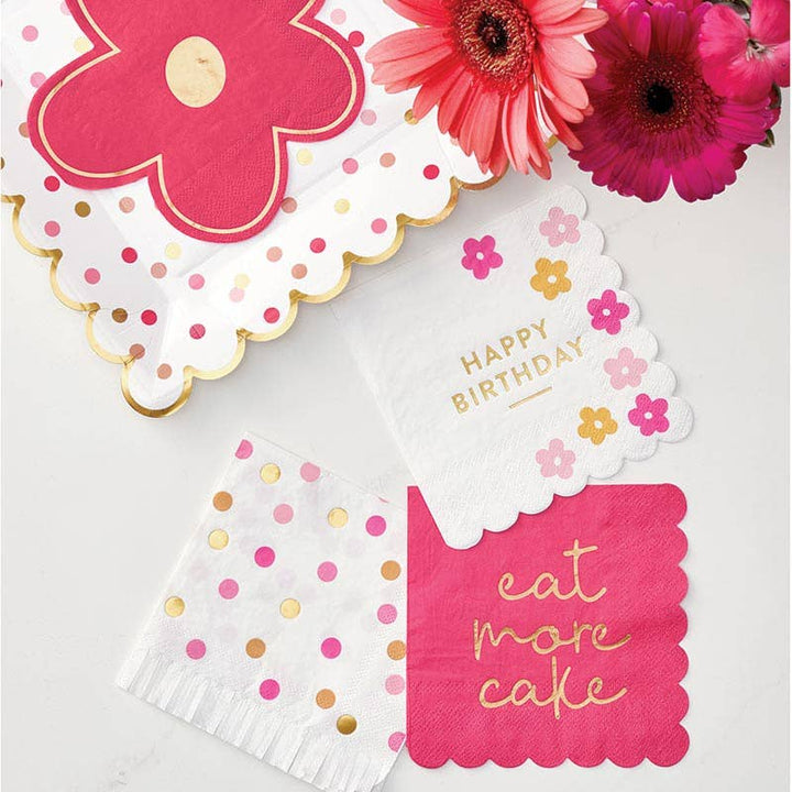Decorative birthday napkins with floral and polka dot designs on a white background.