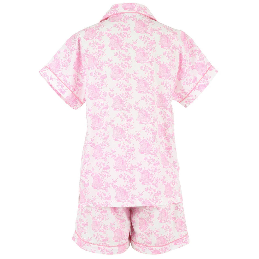 Pink floral shirt and shorts set on a white background