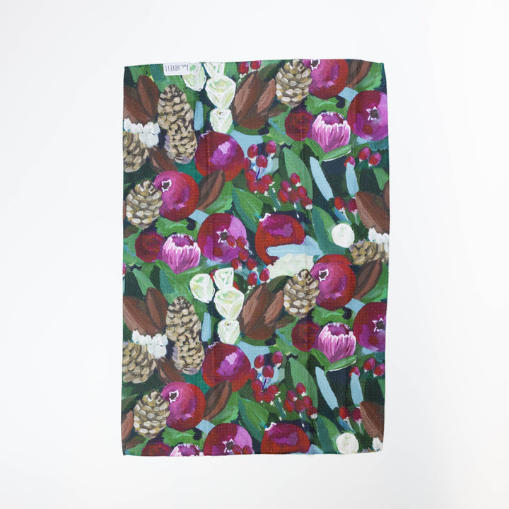 Floral and fruit patterned fabric on a white background