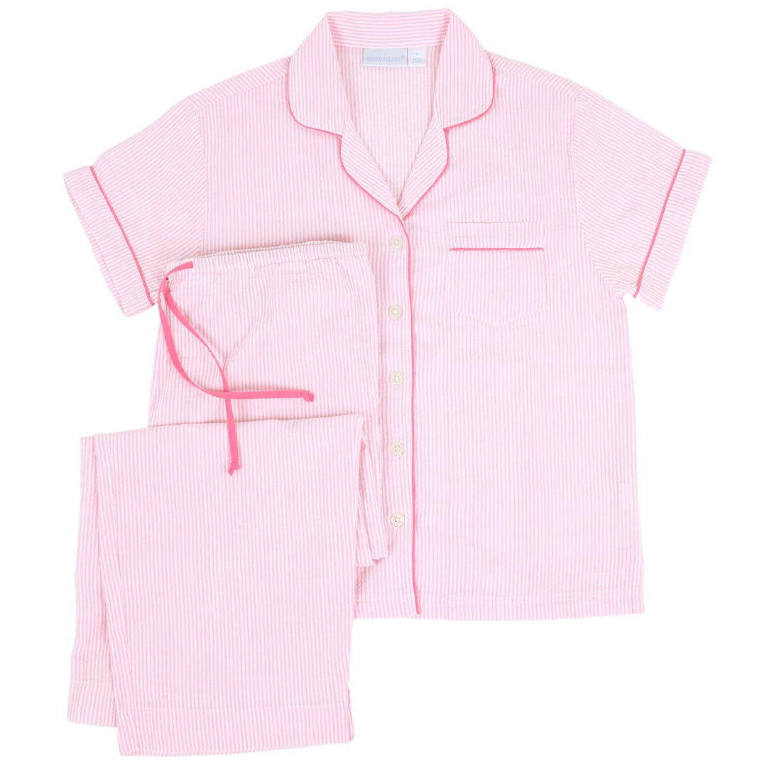 Pink striped pajama set on a white background