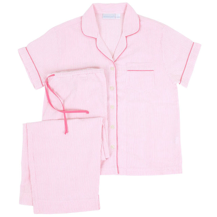Pink striped pajama set on a white background