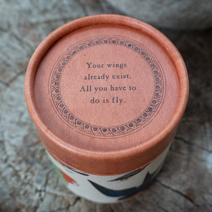 candle box container with a motivational quote on a textured surface