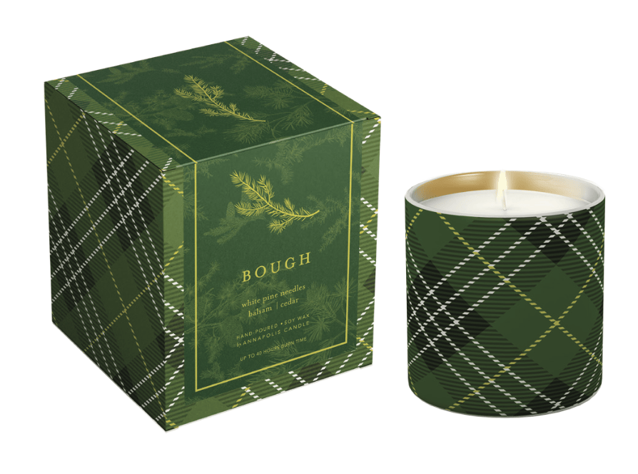 Green plaid candle with matching packaging on a white background