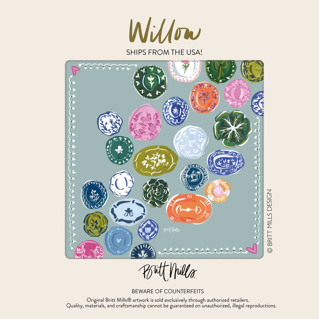 Image of mahjong mat with Colorful plate design on light blue background.
