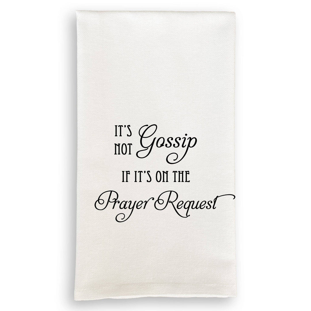 White towel with black text 'It's not gossip if it's on the prayer request' on a white background