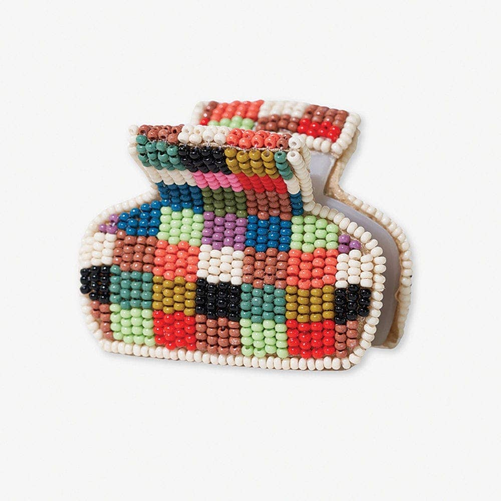 Colorful beaded claw hair clip on a white background