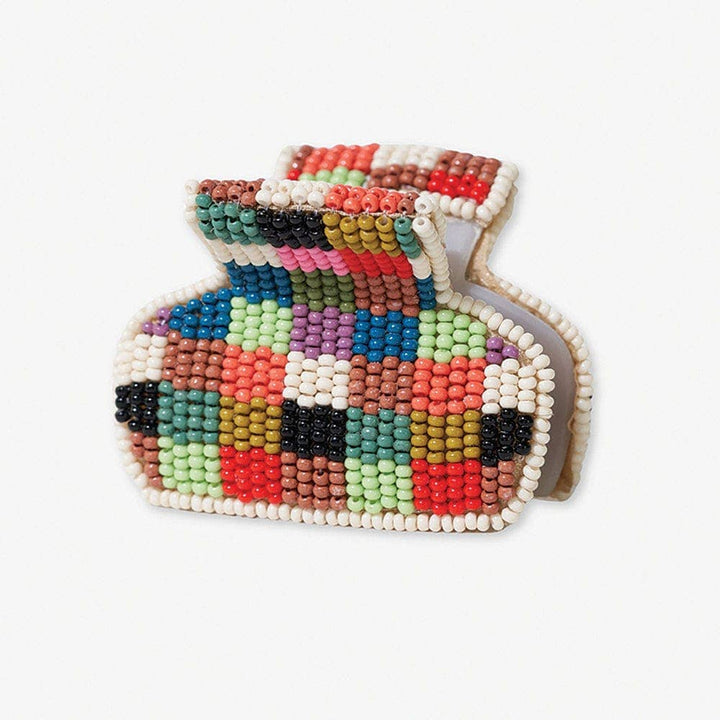 Colorful beaded claw hair clip on a white background