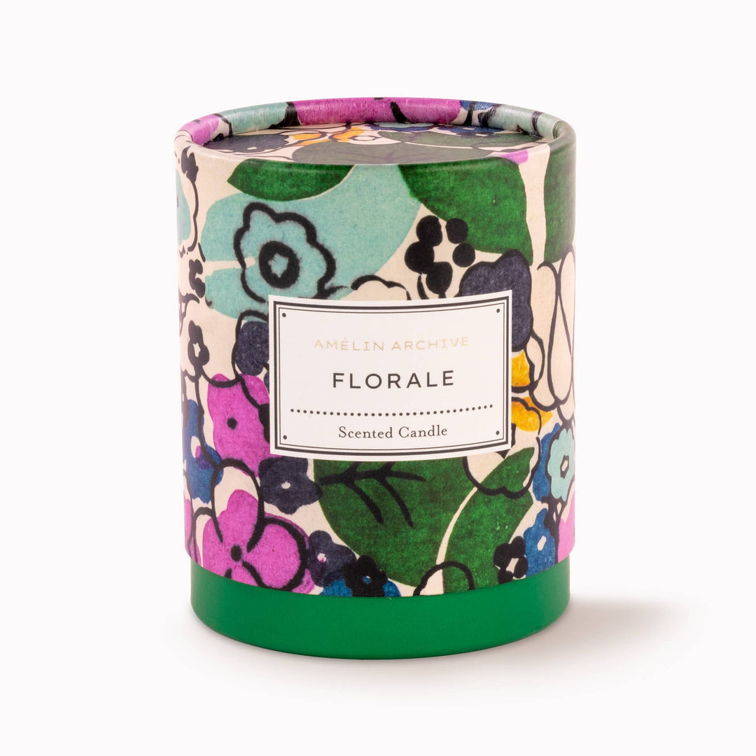 Floral-patterned candle with a label on a white background