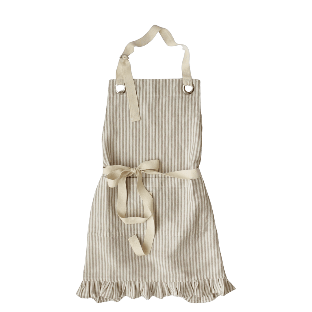A cream and beige vertically striped kitchen apron with a matching fabric waist tie and neck strap, shown against a solid dark green background.