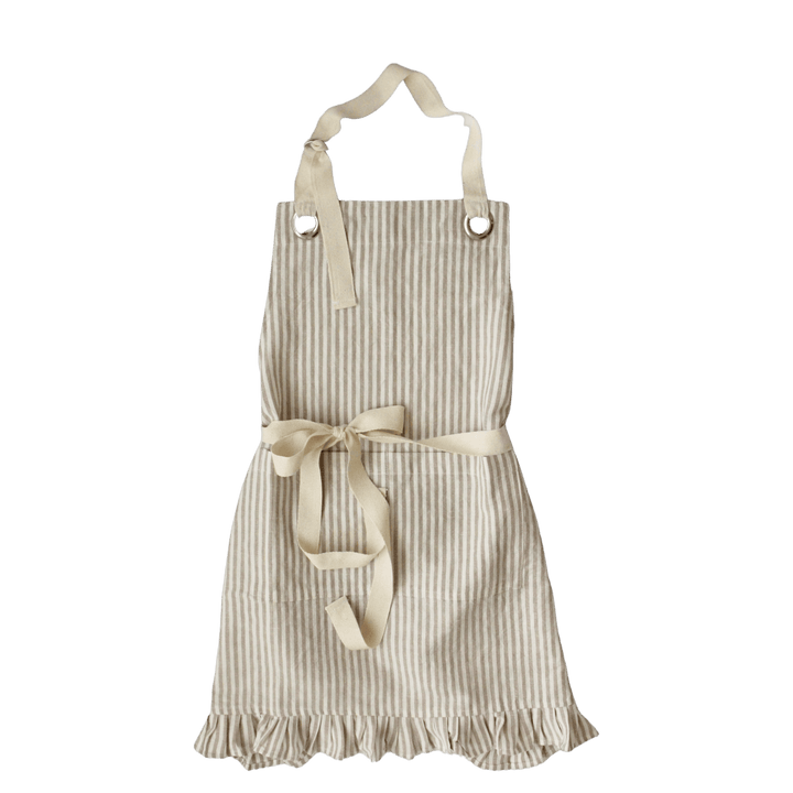 A cream and beige vertically striped kitchen apron with a matching fabric waist tie and neck strap, shown against a solid dark green background.