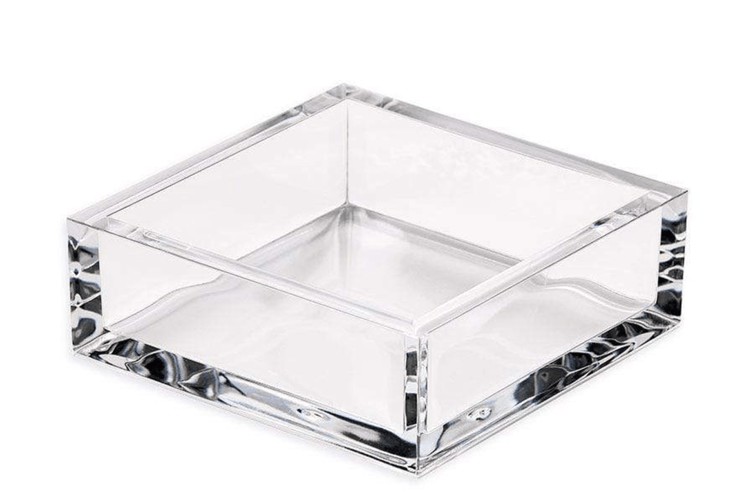 Clear acrylic cocktail napkin holder on white background