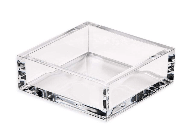 Clear acrylic cocktail napkin holder on white background