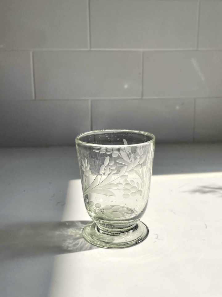 etched drinking glass on white background.