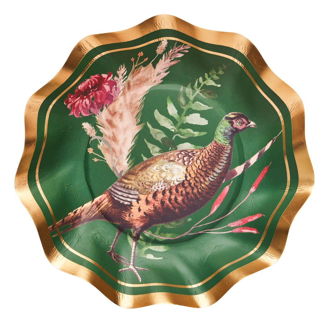 A scalloped-edge paper plate featuring a green background with a detailed illustration of a pheasant bird, red flowers, and botanical leaves, surrounded by a gold border.