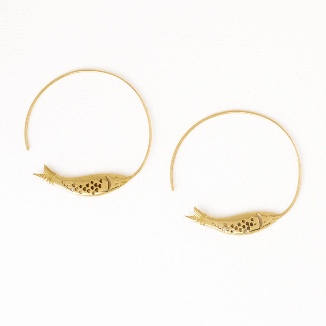 Gold hoop earrings with fish design on a white background