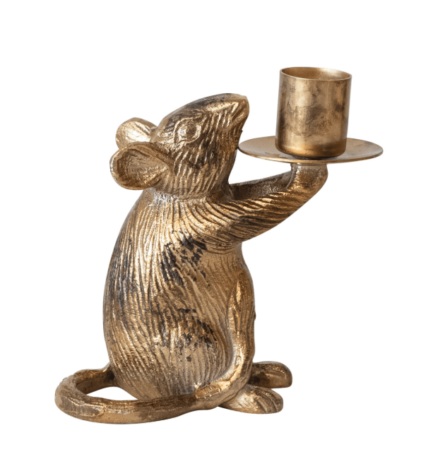 A metallic gold mouse figurine holding a small cylindrical cup on a matching tray, photographed against a plain white background.