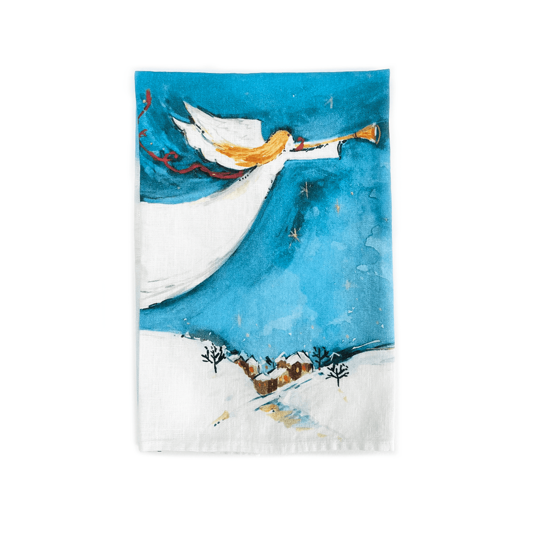 Holiday Angel Kitchen Towel with angel playing a trumpet over a snow hill with tiny houses and a blue painted sky